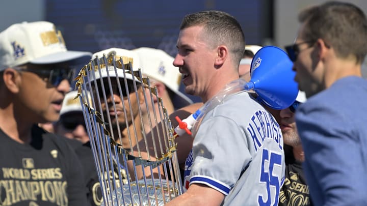 Los Angeles Dodgers starting pitcher Walker Buehler (21) wears a beer bong funnel around his neck during the World Series Championship Celebration at Dodger Stadium on Nov 1. Los Angeles Dodgers starting pitcher Walker Buehler (21) wears a beer bong funnel around his neck during the World Series Championship Celebration at Dodger Stadium on Nov 1.