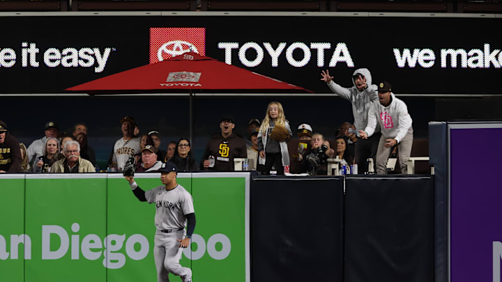 May 25, 2024; San Diego, California, USA; Fans react after New York Yankees right fielder Juan Soto (22) catches a fly ball from San Diego Padres second baseman Jake Cronenworth (9) in the sixth inning at Petco Park. Mandatory Credit: Chadd Cady-Imagn Images