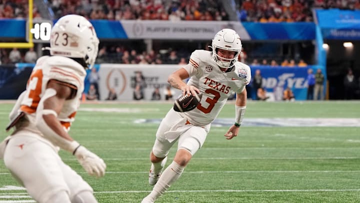 Jan 1, 2025; Atlanta, GA, USA; Texas Longhorns quarterback Quinn Ewers (3) runs with the ball for a touchdown against the Arizona State Sun Devils during the second half of the Peach Bowl at Mercedes-Benz Stadium. Mandatory Credit: Dale Zanine-Imagn Images