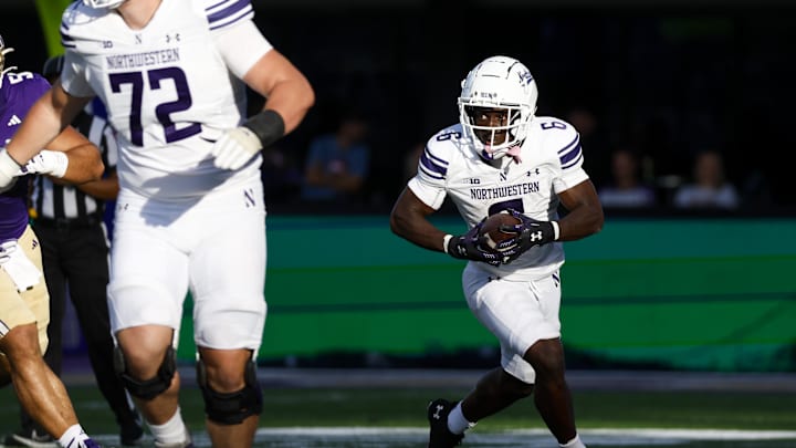 Sep 21, 2024; Seattle, Washington, USA; Northwestern Wildcats running back Joseph Himon II (6) runs for yards after the catch against the Washington Huskies during the second quarter at Alaska Airlines Field at Husky Stadium. Mandatory Credit: Joe Nicholson-Imagn Images Sep 21, 2024; Seattle, Washington, USA; Northwestern Wildcats running back Joseph Himon II (6) runs for yards after the catch against the Washington Huskies during the second quarter at Alaska Airlines Field at Husky Stadium. Mandatory Credit: Joe Nicholson-Imagn Images