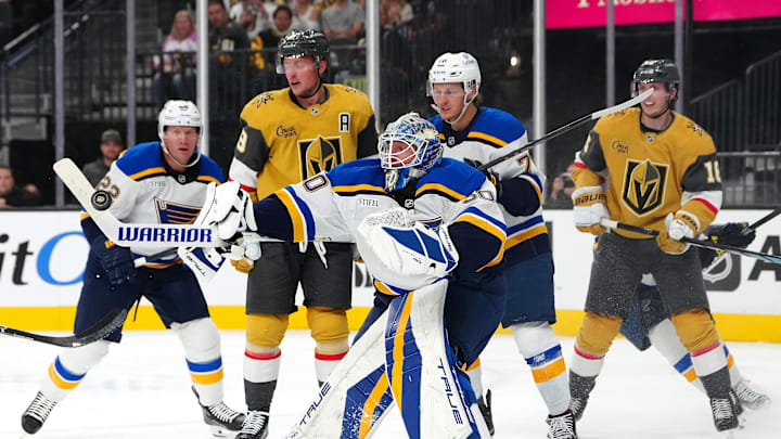 Oct 11, 2024; Las Vegas, Nevada, USA; St. Louis Blues goaltender Jordan Binnington (50) looks to control the puck after making a save against the Vegas Golden Knights during the second period at T-Mobile Arena. Mandatory Credit: Stephen R. Sylvanie-Imagn Images
