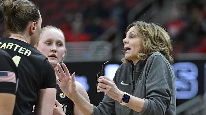 Feb 12, 2026; Louisville, Kentucky, USA; Wake Forest Demon Deacons head coach Megan Gebbia talks with guard Mary Carter (14) and guard Aurora Sorbye (2) during the second half against the Louisville Cardinals at KFC Yum! Center. Louisville defeated Wake Forest 86-67. Mandatory Credit: Jamie Rhodes-Imagn Images Feb 12, 2026; Louisville, Kentucky, USA; Wake Forest Demon Deacons head coach Megan Gebbia talks with guard Mary Carter (14) and guard Aurora Sorbye (2) during the second half against the Louisville Cardinals at KFC Yum! Center. Louisville defeated Wake Forest 86-67. Mandatory Credit: Jamie Rhodes-Imagn Images