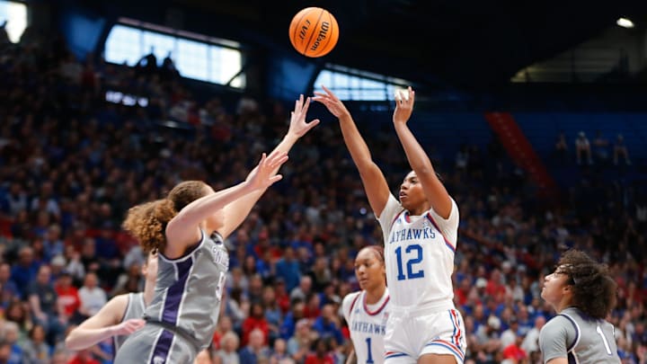 Kansas freshman guard S'Mya Nichols (12) shoots against Kansas State in the first half of the