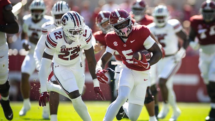 Oct 12, 2024; Tuscaloosa, Alabama, USA; South Carolina Gamecocks linebacker Bam Martin-Scott (22) pursues Alabama Crimson Tide wide receiver Germie Bernard (5) as he carries the ball down the field during the first quarter at Bryant-Denny Stadium. Mandatory Credit: Will McLelland-Imagn Images