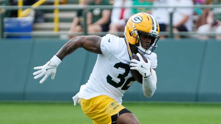 Green Bay Packers running back MarShawn Lloyd (32) runs through a drill during the second day of training camp on Thursday, July 24, 2025, at Ray Nitschke Field in Ashwaubenon, Wis.