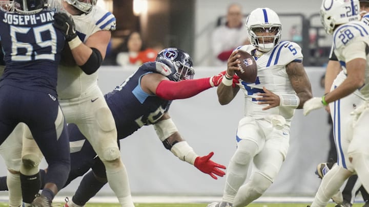 Dec 22, 2024; Indianapolis, Indiana, USA; Indianapolis Colts quarterback Anthony Richardson (5) is sacked by Tennessee Titans defensive tackle Jeffery Simmons (98) during a game against the Tennessee Titans at Lucas Oil Stadium. Mandatory Credit: Christine Tannous/USA Today Network via Imagn Images Dec 22, 2024; Indianapolis, Indiana, USA; Indianapolis Colts quarterback Anthony Richardson (5) is sacked by Tennessee Titans defensive tackle Jeffery Simmons (98) during a game against the Tennessee Titans at Lucas Oil Stadium. Mandatory Credit: Christine Tannous/USA Today Network via Imagn Images