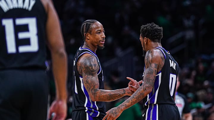 Jan 10, 2025; Boston, Massachusetts, USA; Sacramento Kings forward DeMar DeRozan (10) and guard Malik Monk (0) react after defeating the Boston Celtics in the second half at TD Garden. Mandatory Credit: David Butler II-Imagn Images