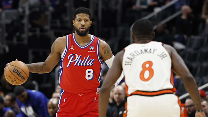 Feb 7, 2025; Detroit, Michigan, USA; Philadelphia 76ers forward Paul George (8) dribbles defended by Detroit Red Wings defenseman Ben Chiarot (8) in the first half at Little Caesars Arena. Mandatory Credit: Rick Osentoski-Imagn Images Feb 7, 2025; Detroit, Michigan, USA; Philadelphia 76ers forward Paul George (8) dribbles defended by Detroit Red Wings defenseman Ben Chiarot (8) in the first half at Little Caesars Arena. Mandatory Credit: Rick Osentoski-Imagn Images