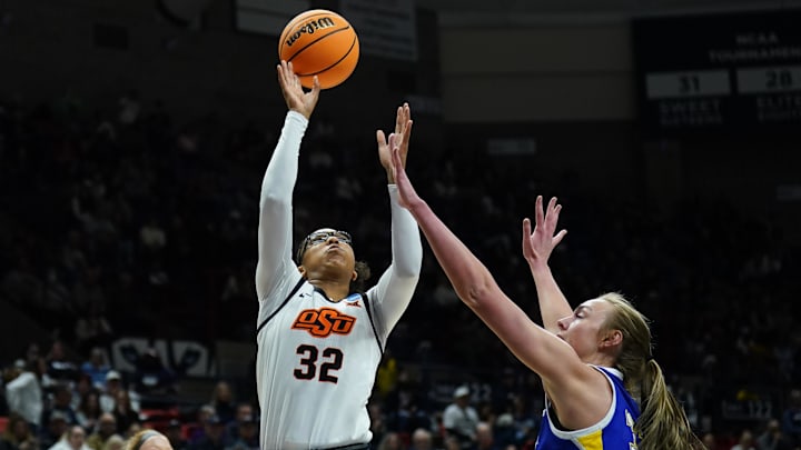 Mar 22, 2025; Storrs, Connecticut, USA; Oklahoma State Cowgirls guard Stailee Heard (32) shoots the ball against the against the South Dakota State Jackrabbits in the first half at Harry A. Gampel Pavilion. Mandatory Credit: David Butler II-Imagn Images