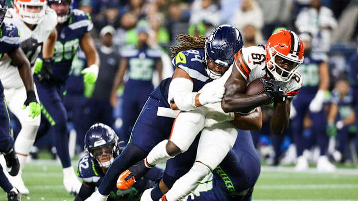 Aug 24, 2024; Seattle, Washington, USA; Seattle Seahawks defensive end Mike Morris (94) tackles Cleveland Browns wide receiver Michael Woods II (81) following a reception by Woods II during the second quarter at Lumen Field. Aug 24, 2024; Seattle, Washington, USA; Seattle Seahawks defensive end Mike Morris (94) tackles Cleveland Browns wide receiver Michael Woods II (81) following a reception by Woods II during the second quarter at Lumen Field.