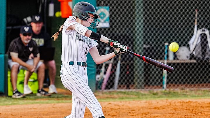 Melbourne’s Addison Balavender drives a Viera pitch into the outfield during the Class 6A, District 7 softball championship game. The freshman struck out 11 and allowed just three hits and one walk in five innings pitched, and went 1-for-2 with three RBI to power the Bulldogs past Viera, 11-0.