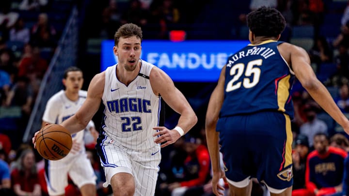 Mar 13, 2025; New Orleans, Louisiana, USA;  Orlando Magic forward Franz Wagner (22) brings the ball up court against New Orleans Pelicans guard Trey Murphy III (25) during the first half at Smoothie King Center. Mandatory Credit: Stephen Lew-Imagn Images