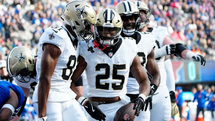 New Orleans Saints running back Kendre Miller (25) and his teammates celebrate the only touchdown of the first quarter, Sunday, December 8, 2024.