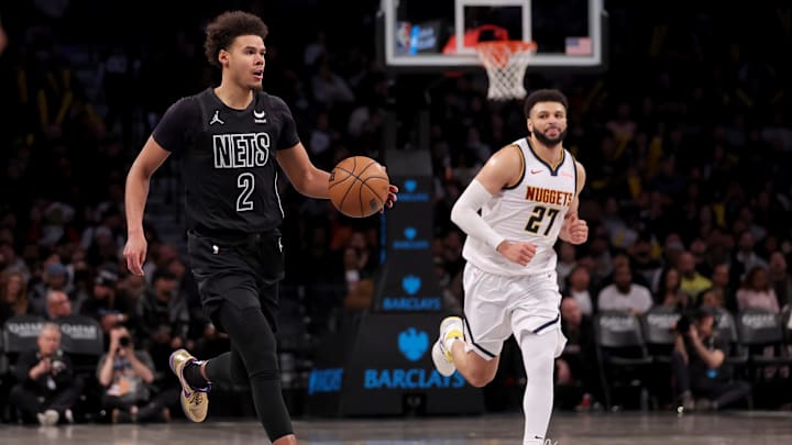 Dec 22, 2023; Brooklyn, New York, USA; Brooklyn Nets forward Cameron Johnson (2) brings the ball up court against against Denver Nuggets guard Jamal Murray (27) during the third quarter at Barclays Center. Mandatory Credit: Brad Penner-Imagn Images Dec 22, 2023; Brooklyn, New York, USA; Brooklyn Nets forward Cameron Johnson (2) brings the ball up court against against Denver Nuggets guard Jamal Murray (27) during the third quarter at Barclays Center. Mandatory Credit: Brad Penner-Imagn Images