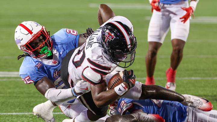 TTU RB J'Koby Williams is tackled by Houston LB Carmycah Glass i n the second half at TDECU Stadium. Mandatory Credit: Thomas Shea-Imagn Images TTU RB J'Koby Williams is tackled by Houston LB Carmycah Glass i n the second half at TDECU Stadium. Mandatory Credit: Thomas Shea-Imagn Images