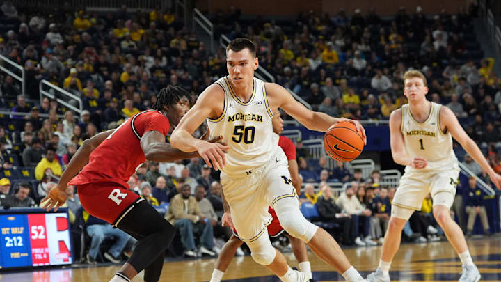 Michigan Wolverines center Vladislav Goldin (50) drives the lane against Rutgers Scarlet Knights defense during the first half of the NCAA basketball game at Crisler Arena in Ann Arbor, Mich., Thursday, February 27 2025.