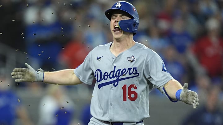 Dodgers catcher Will Smith (16) celebrates after hitting a home run against the Toronto Blue Jays in the eleventh inning during game seven of the 2025 MLB World Series at Rogers Centre on Saturday.