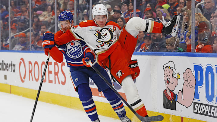 Mar 28, 2026; Edmonton, Alberta, CAN; Edmonton Oilers forward Zach Hyman (18) trips up Anaheim Ducks defensemen Jackson LaCombe (2) during the third period at Rogers Place. Mandatory Credit: Perry Nelson-Imagn Images