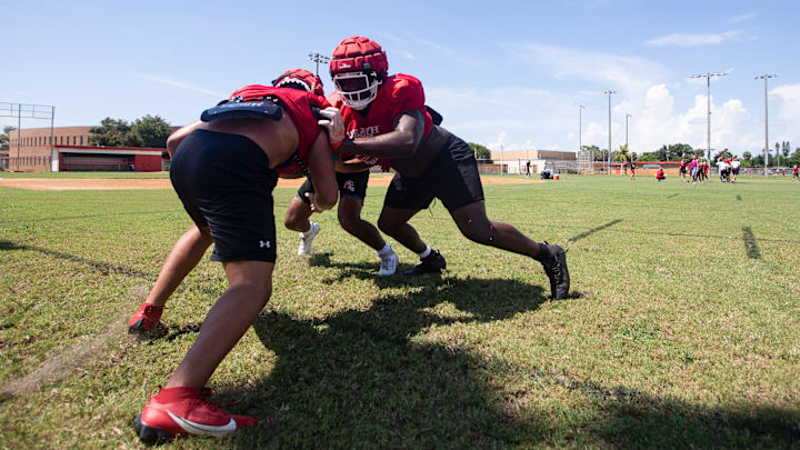 James Johnson, right, a defensive lineman for the North Fort Myers High School football team practices with teammates on Tuesday, Sept. 17, 2024.
