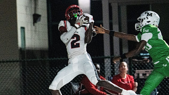 Jadell Carter, #2, of the South Fort Myers High School football team hauls in a pass for a touchdown against Fort Myers on Friday, Sept. 12, 2025. South won.