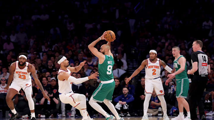 May 16, 2025; New York, New York, USA; Boston Celtics guard Derrick White (9) controls the ball against New York Knicks guard Josh Hart (3) and center Mitchell Robinson (23) and guard Miles McBride (2) during the second quarter of game six in the second round of the 2025 NBA Playoffs at Madison Square Garden. Mandatory Credit: Brad Penner-Imagn Images