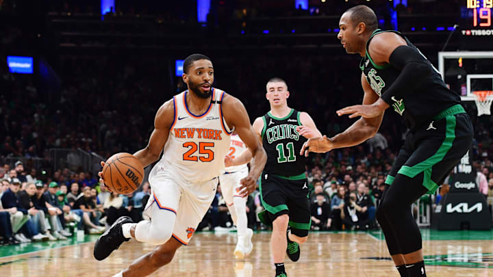 May 14, 2025; Boston, Massachusetts, USA; New York Knicks forward Mikal Bridges (25) controls the ball while Boston Celtics center Al Horford (42) defends in the first half during game five of the second round for the 2025 NBA Playoffs at TD Garden. Mandatory Credit: Bob DeChiara-Imagn Images