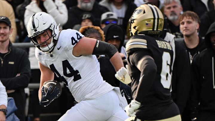 Penn State tight end Tyler Warren runs by Purdue Boilermakers defensive back Smiley Bradford during the first quarter at Ross-Ade Stadium. 
