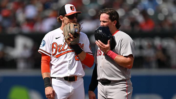 Sep 6, 2026; Baltimore, Maryland, USA;  Former teammates Baltimore Orioles infielder Gunnar Henderson (2) and Boston Red Sox catcher Adley Rutschman (31) talk at second base during a time out in the third inning at Oriole Park at Camden Yards. Mandatory Credit: Jamie Sabau-Imagn Images