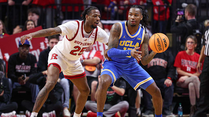 Jan 13, 2025; Piscataway, New Jersey, USA; UCLA Bruins guard Sebastian Mack (12) looks to pass as Rutgers Scarlet Knights guard Jeremiah Williams (25) defends during the second half at Jersey Mike's Arena. Mandatory Credit: Vincent Carchietta-Imagn Images Jan 13, 2025; Piscataway, New Jersey, USA; UCLA Bruins guard Sebastian Mack (12) looks to pass as Rutgers Scarlet Knights guard Jeremiah Williams (25) defends during the second half at Jersey Mike's Arena. Mandatory Credit: Vincent Carchietta-Imagn Images