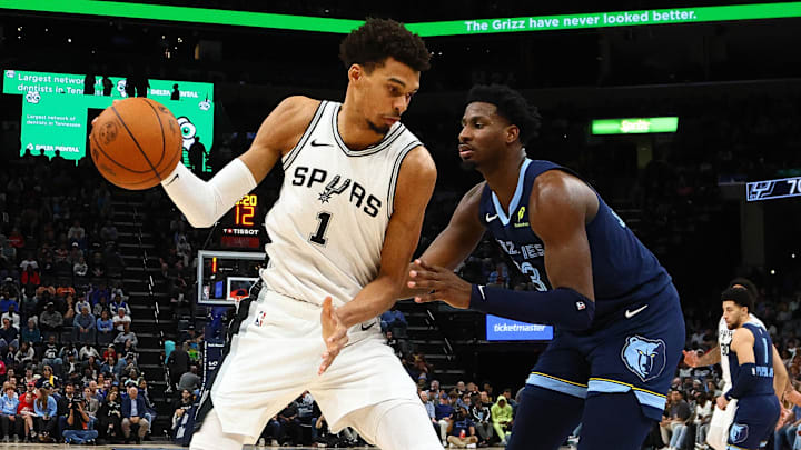 Feb 3, 2025; Memphis, Tennessee, USA; San Antonio Spurs center Victor Wembanyama (1) drives to the basket as Memphis Grizzlies forward Jaren Jackson Jr. (13) defends during the third quarter at FedExForum. Mandatory Credit: Petre Thomas-Imagn Images