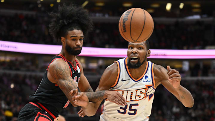 Nov 8, 2023; Chicago, Illinois, USA; Chicago Bulls guard Coby White (0) and Phoenix Suns forward Kevin Durant (35) watch the ball go out of  bounds after White fouled Durant in the second half at United Center. Mandatory Credit: Jamie Sabau-Imagn Images