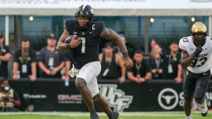 Sep 28, 2024; Orlando, Florida, USA; UCF Knights quarterback KJ Jefferson (1) runs during the second half against the Colorado Buffaloes at FBC Mortgage Stadium. Mandatory Credit: Mike Watters-Imagn Images