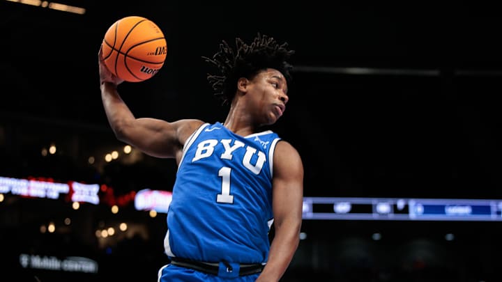 Mar 11, 2026; Kansas City, MO, USA; BYU Cougars guard Robert Wright III (1) rebounds during the first half against the West Virginia Mountaineers at T-Mobile Center. Mandatory Credit: William Purnell-Imagn Images
