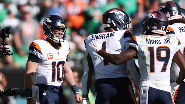 Oct 5, 2025; Philadelphia, Pennsylvania, USA; Denver Broncos tight end Evan Engram (1) celebrates with quarterback Bo Nix (10) and wide receiver Marvin Mims Jr. (19) after scoring a touchdown against the Philadelphia Eagles in the second half at Lincoln Financial Field. Mandatory Credit: Bill Streicher-Imagn Images