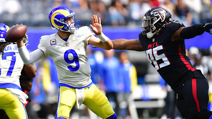 Sep 18, 2022; Inglewood, California, USA; Los Angeles Rams quarterback Matthew Stafford (9) throws under pressure from Atlanta Falcons defensive tackle Ta'Quon Graham (95) during the first half at SoFi Stadium. Mandatory Credit: Gary A. Vasquez-Imagn Images Sep 18, 2022; Inglewood, California, USA; Los Angeles Rams quarterback Matthew Stafford (9) throws under pressure from Atlanta Falcons defensive tackle Ta'Quon Graham (95) during the first half at SoFi Stadium. Mandatory Credit: Gary A. Vasquez-Imagn Images