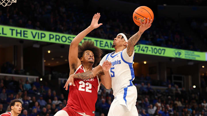 Feb 9, 2025; Memphis, Tennessee, USA; Memphis Tigers guard Dante Harris (5) shoots the ball against Temple Owls forward Elijah Gray (22), who transferred to the Wisconsin Badgers. Feb 9, 2025; Memphis, Tennessee, USA; Memphis Tigers guard Dante Harris (5) shoots the ball against Temple Owls forward Elijah Gray (22), who transferred to the Wisconsin Badgers.