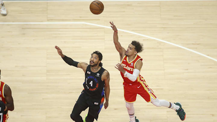 May 28, 2021; Atlanta, Georgia, USA; Atlanta Hawks guard Trae Young (11) shoots the ball over New York Knicks guard Derrick Rose (4) in the first quarter during game three in the first round of the 2021 NBA Playoffs at State Farm Arena. Mandatory Credit: Brett Davis-Imagn Images