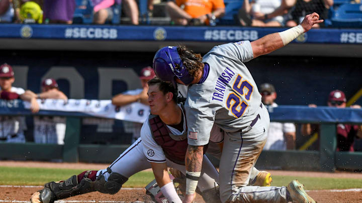 LSU base runner Hayden Travinski is out at home as Texas A&M catcher Max Kaufer holds onto the throw on a safety squeeze play during the SEC Tournament elimination game Friday, May 26, 2023, at the Hoover Met.
