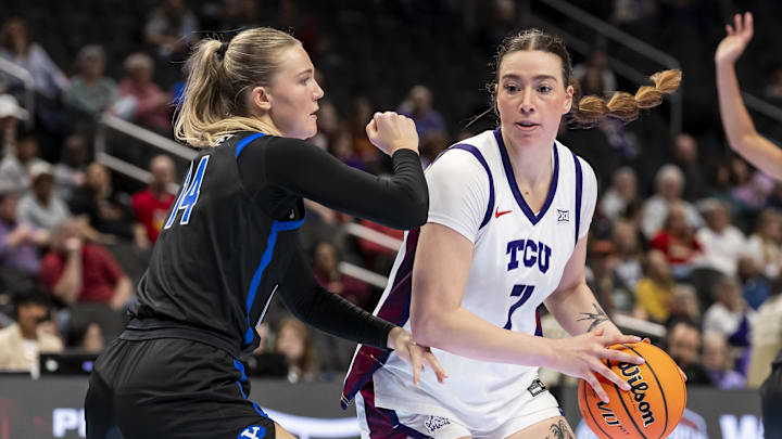 Mar 6, 2026; Kansas City, MO, USA; TCU Horned Frogs forward Marta Suárez (7) attempts to bypass BYU Cougars guard Kambree Barber (14) during the first half at T-Mobile Center. Mandatory Credit: Nick Tre. Smith-Imagn Images