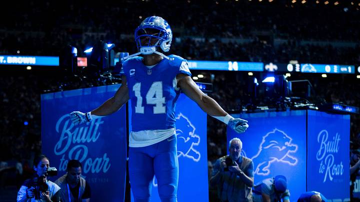 Detroit Lions wide receiver Amon-Ra St. Brown (14) runs out onto the field ahead of a game against the New Orleans Saints at Ford Field in Detroit on Sunday Sept. 13, 2026. Detroit Lions wide receiver Amon-Ra St. Brown (14) runs out onto the field ahead of a game against the New Orleans Saints at Ford Field in Detroit on Sunday Sept. 13, 2026.