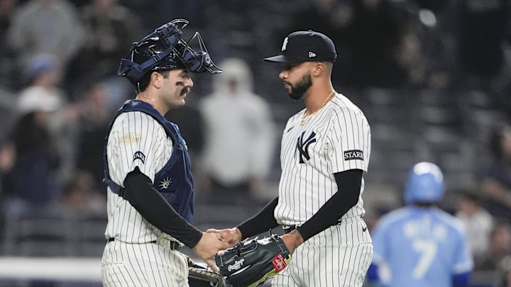 Apr 14, 2025; Bronx, New York, USA; New York Yankees catcher Austin Wells (28) and pitcher Devin Williams (38) shake hands to celebrate the victory after the game against the Kansas City Royals at Yankee Stadium. Mandatory Credit: Gregory Fisher-Imagn Images