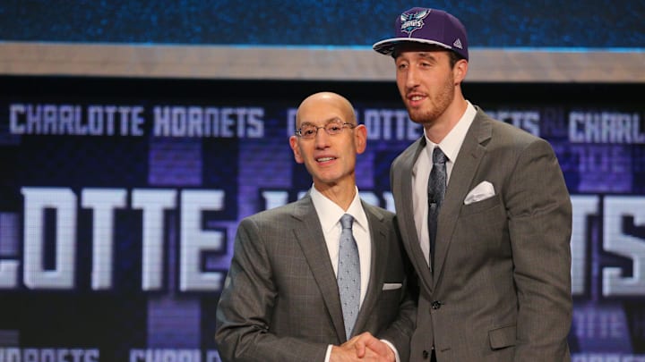 Frank Kaminsky (Wisconsin) greets NBA commissioner Adam Silver after being selected as the number nine overall pick to the Charlotte Hornets in the first round of the 2015 NBA Draft at Barclays Center.