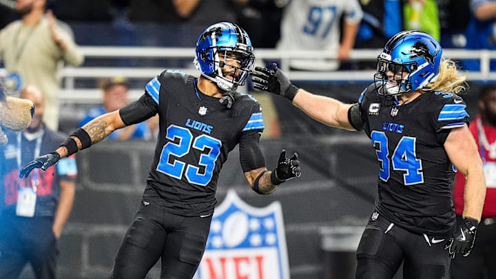 Detroit Lions cornerback Carlton Davis III (23) celebrates a fumble recovery with linebacker Alex Anzalone (34) 