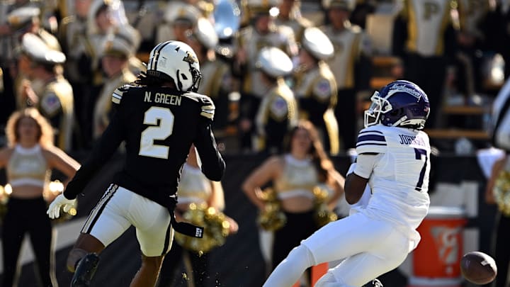 Nov 2, 2024; West Lafayette, Indiana, USA; Northwestern Wildcats wide receiver Calvin Johnson II (7) cannot catch a long pass against Purdue Boilermakers defensive back Nyland Green (2) during the second half at Ross-Ade Stadium. Mandatory Credit: Marc Lebryk-Imagn Images