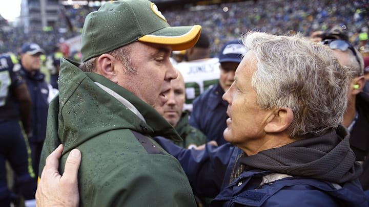 Mike McCarthy greets Pete Carroll after a Packers-Seahawks game. Some of McCarthy's issues in Dallas sound like Bears problems last year.