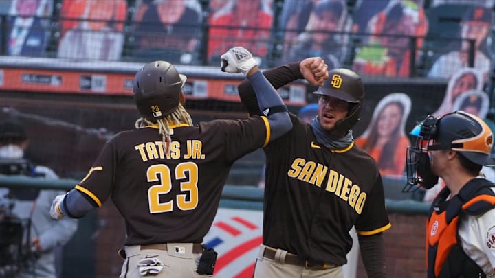 Jul 28, 2020; San Francisco, California, USA; San Diego Padres shortstop Fernando Tatis Jr. (23) celebrates with right fielder Will Myers (4) after batting him in on a three run home run against the San Francisco Giants during the third inning at Oracle Park. 