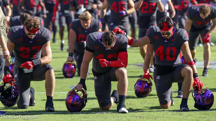 TCU Players in Prayer before game
