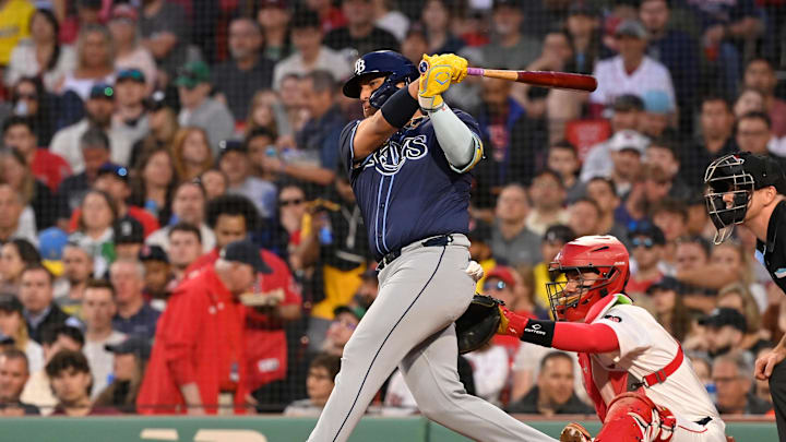 May 14, 2024; Boston, Massachusetts, USA; Tampa Bay Rays designated hitter Isaac Paredes (17) hits a single against the Boston Red Sox during the fourth inning at Fenway Park. Mandatory Credit: Eric Canha-Imagn Images