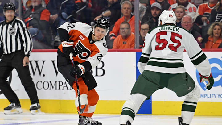 Oct 18, 2025; Philadelphia, Pennsylvania, USA; Philadelphia Flyers center Christian Dvorak (22) passes the puck against Minnesota Wild defenseman David Jiricek (55) during the first period at Wells Fargo Center. Oct 18, 2025; Philadelphia, Pennsylvania, USA; Philadelphia Flyers center Christian Dvorak (22) passes the puck against Minnesota Wild defenseman David Jiricek (55) during the first period at Wells Fargo Center.