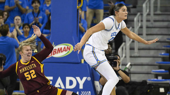 Feb 2, 2025; Los Angeles, California, USA; Minnesota Golden Gophers center Sophie Hart (52) hits the floor after getting fouled by UCLA Bruins center Lauren Betts (51) during the second quarter at Pauley Pavilion presented by Wescom. Mandatory Credit: Robert Hanashiro-Imagn Images Feb 2, 2025; Los Angeles, California, USA; Minnesota Golden Gophers center Sophie Hart (52) hits the floor after getting fouled by UCLA Bruins center Lauren Betts (51) during the second quarter at Pauley Pavilion presented by Wescom. Mandatory Credit: Robert Hanashiro-Imagn Images